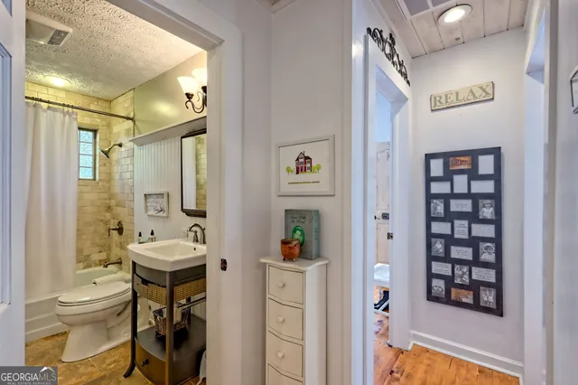 a bathroom with a sink a mirror and a shower
