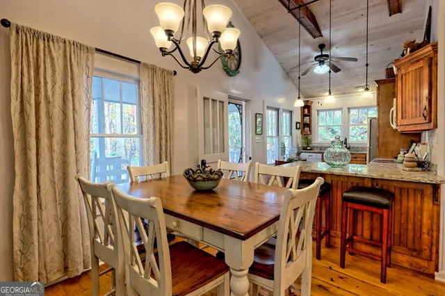 a view of a dining room with furniture window and outside view