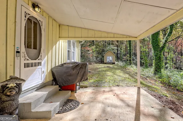 a room with furniture and a floor to ceiling window