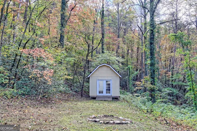 a house view with a backyard space
