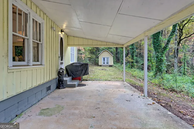 a view of backyard with seating space