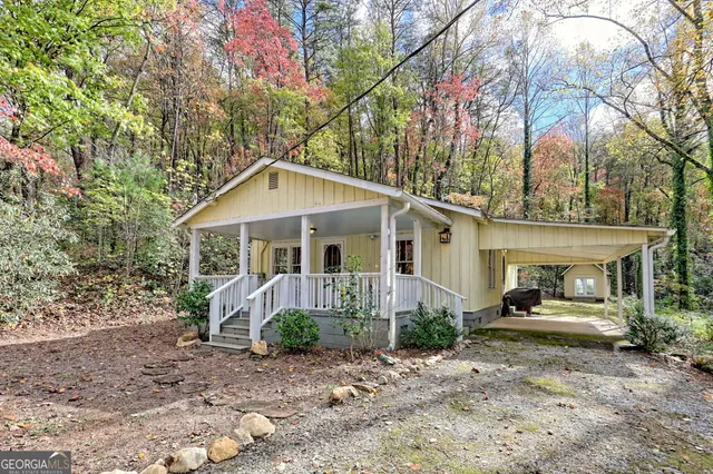 a front view of a house with garden