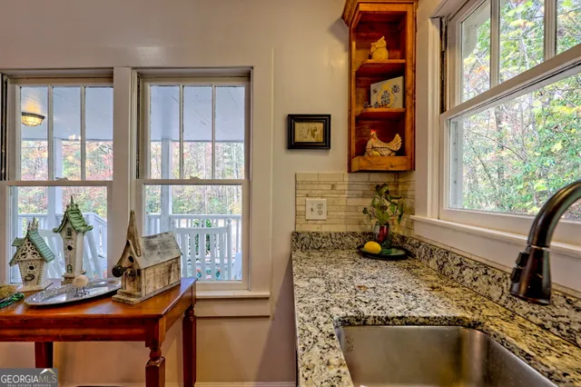 a kitchen with a sink and a window