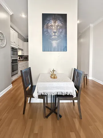 a view of a dining room with furniture wooden floor and a rug
