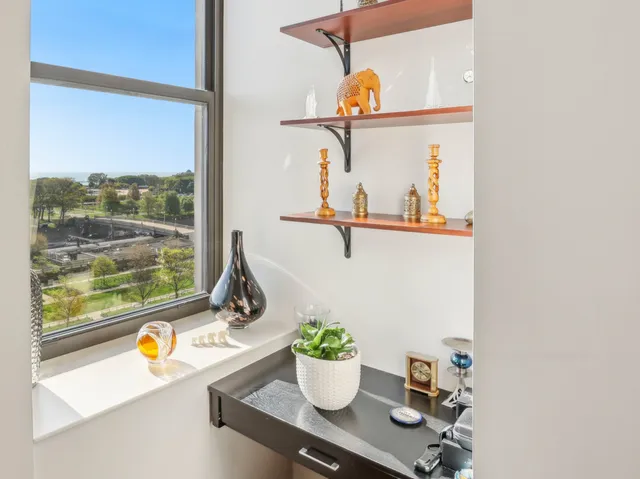 a view of dining room with a table and chairs