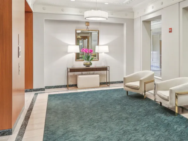 a kitchen with stainless steel appliances a refrigerator and a stove top oven