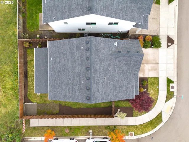 an aerial view of a house with swimming pool