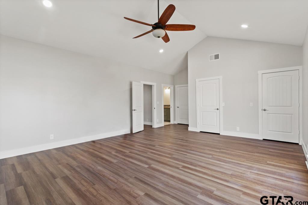 2819 New Copeland Road Tyler, TX 75701 - Photo 19 of 39 wooden floor in an empty room with a window