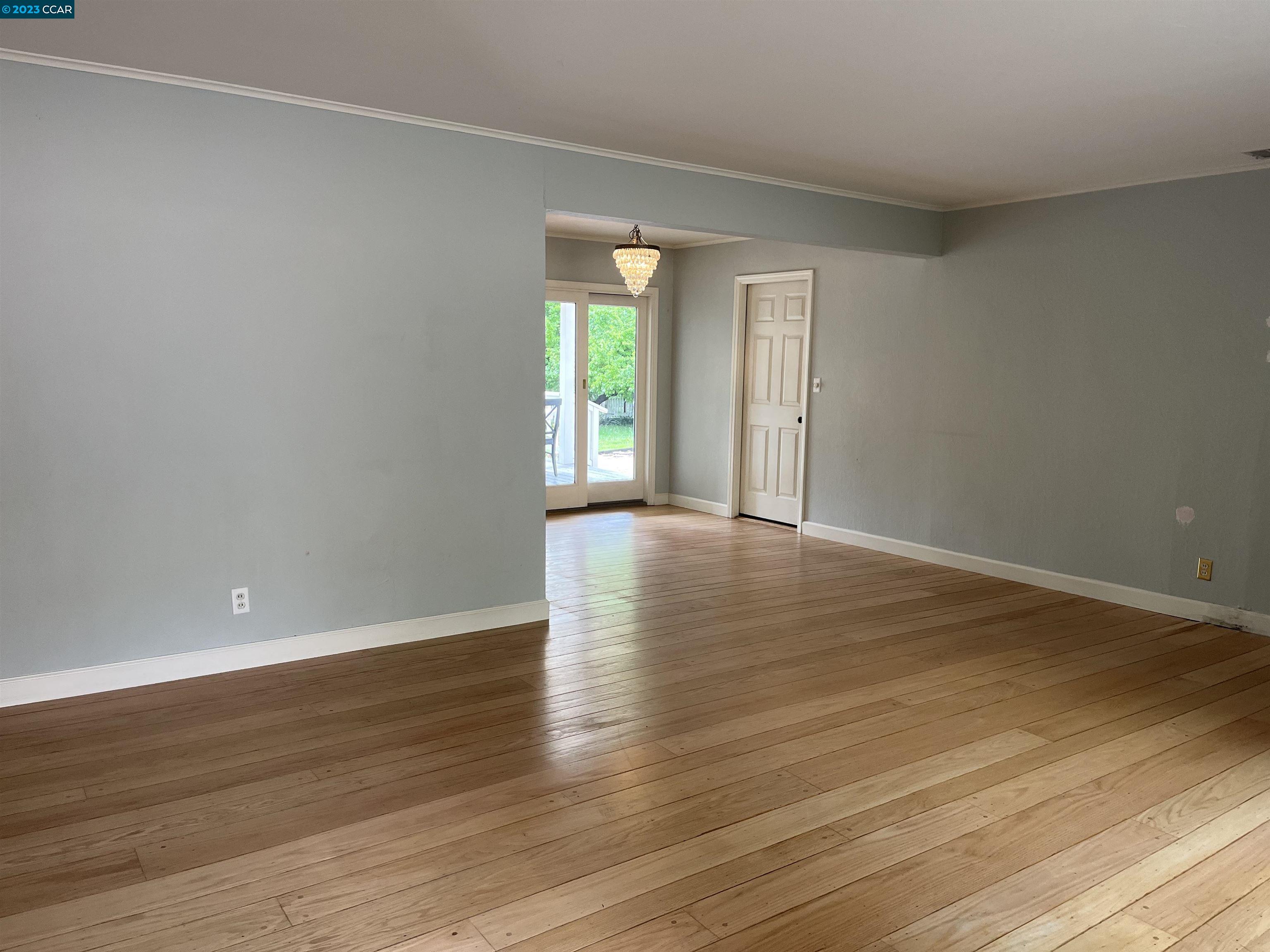 3524 Oliver Court Lafayette, CA 94549 - Photo 11 of 32 a view of an empty room with wooden floor and a window