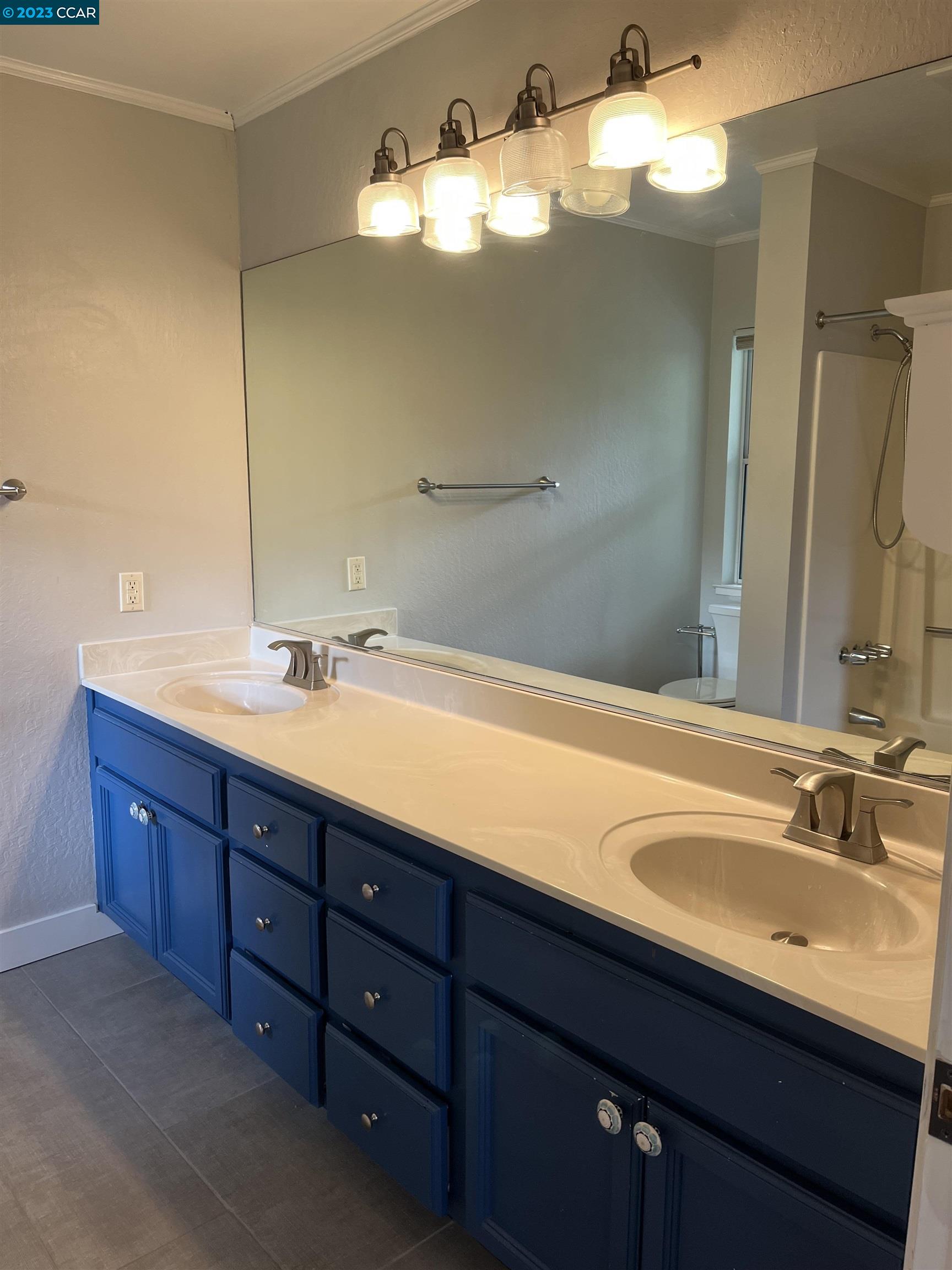 3524 Oliver Court Lafayette, CA 94549 - Photo 17 of 32 a bathroom with a double vanity sink and a mirror