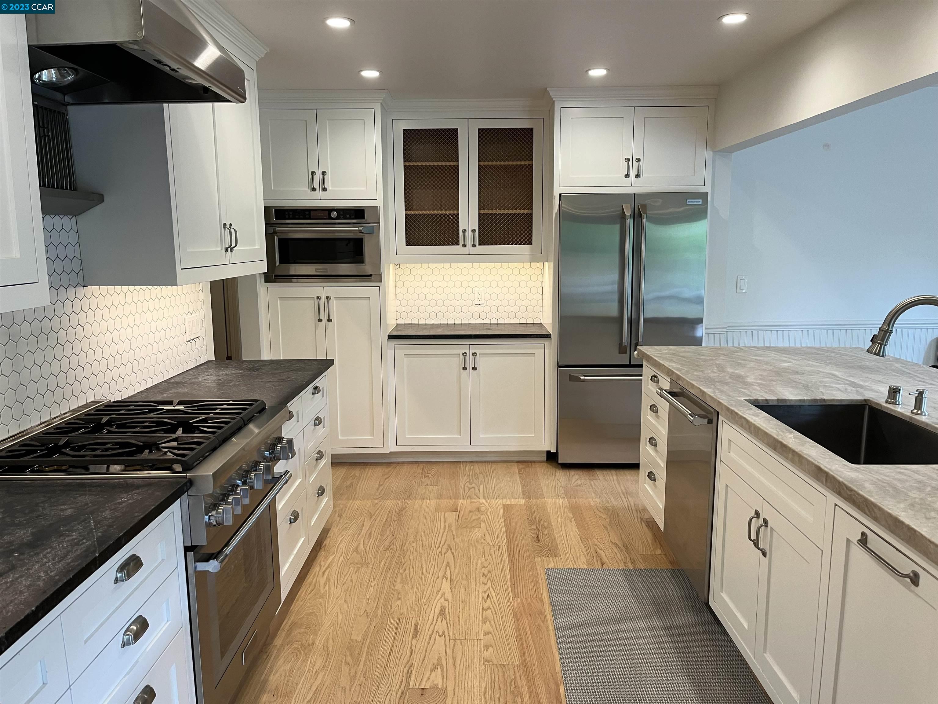 3524 Oliver Court Lafayette, CA 94549 - Photo 4 of 32 a kitchen with a sink stove and refrigerator