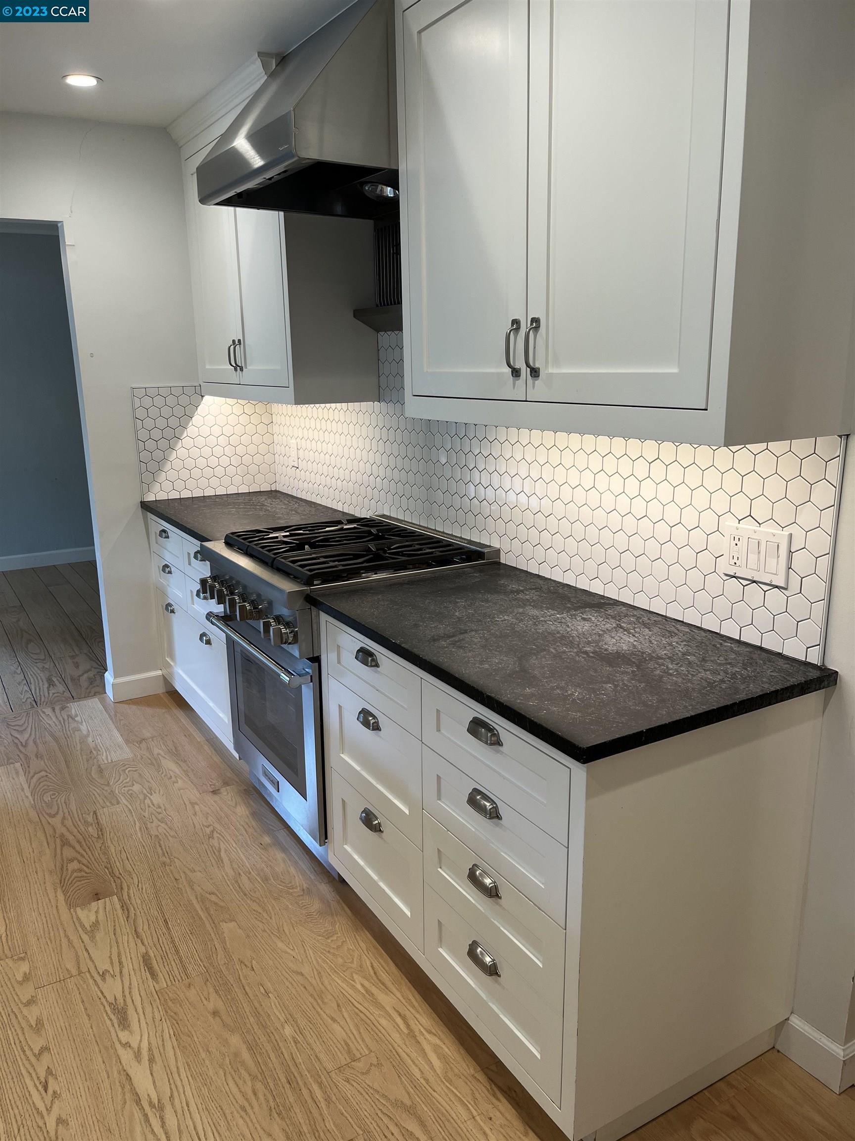 3524 Oliver Court Lafayette, CA 94549 - Photo 6 of 32 a kitchen with granite countertop a stove and a sink