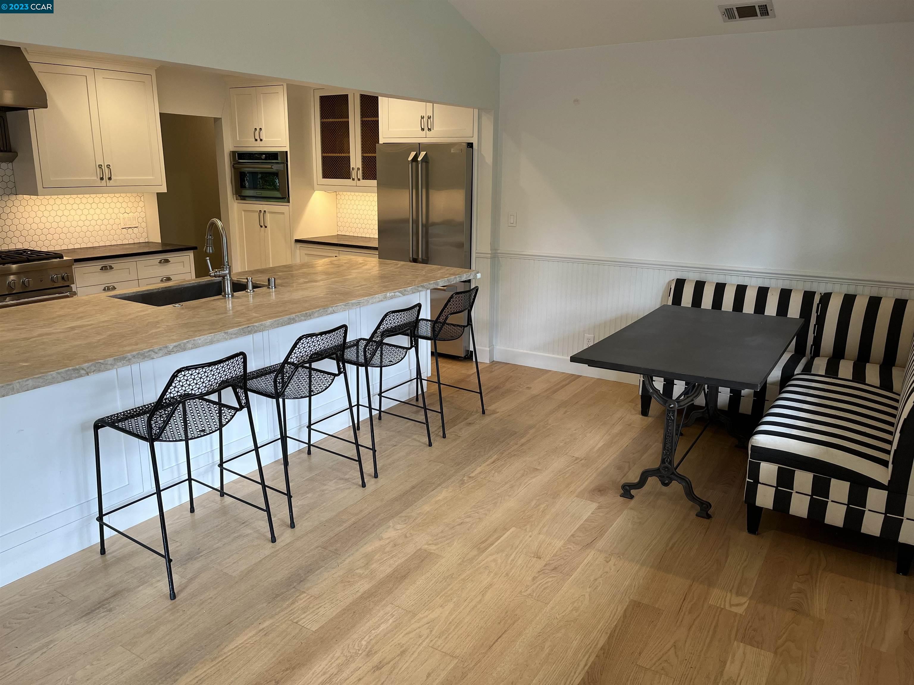 3524 Oliver Court Lafayette, CA 94549 - Photo 8 of 32 a view of a dining room with furniture and wooden floor