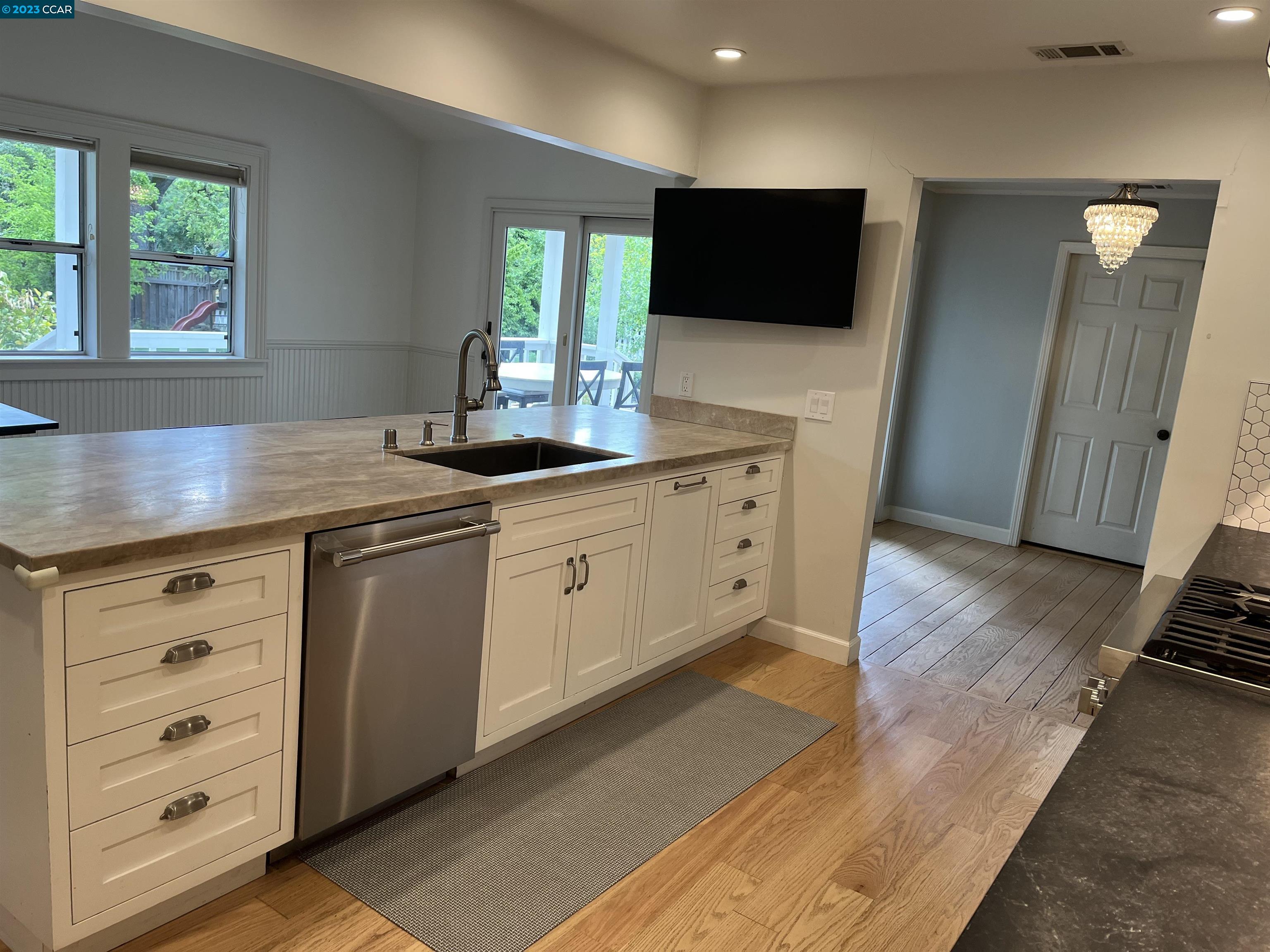 3524 Oliver Court Lafayette, CA 94549 - Photo 9 of 32 a kitchen with stainless steel appliances granite countertop a sink and a granite counter tops