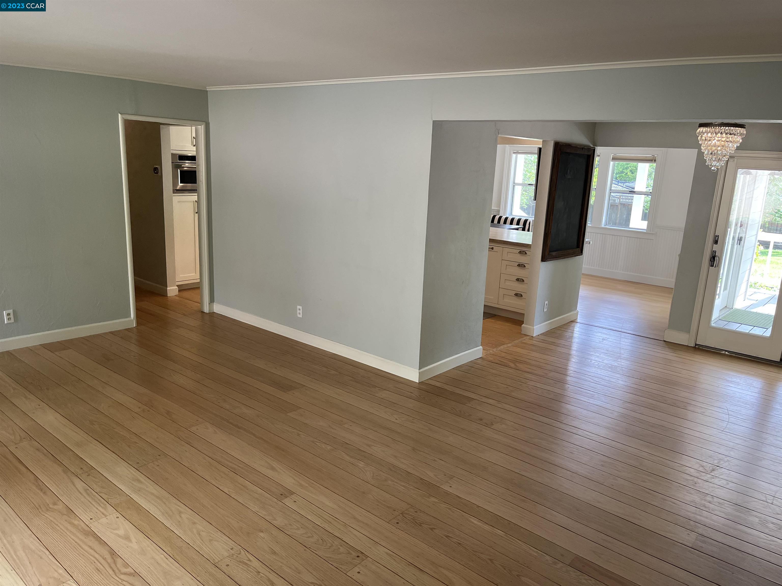3524 Oliver Court Lafayette, CA 94549 - Photo 10 of 32 an empty room with wooden floor and windows