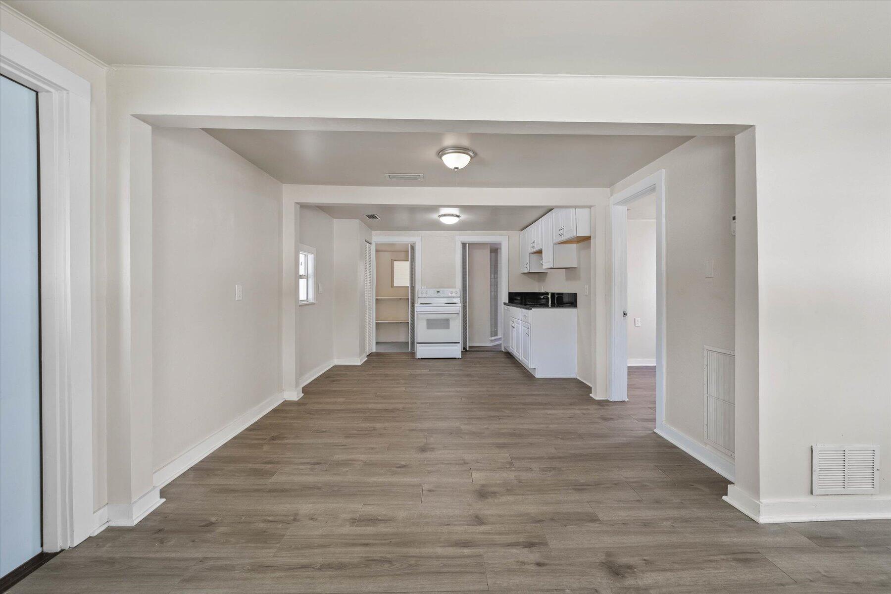 7936 Terrace Road Lantana, FL 33462 - Photo 11 of 25 a view of a big room with wooden floor and a bathroom