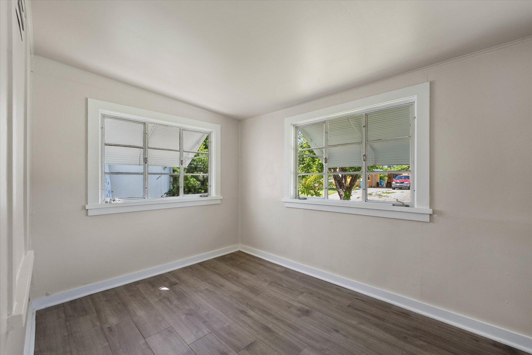7936 Terrace Road Lantana, FL 33462 - Photo 14 of 25 an empty room with window and air conditioner