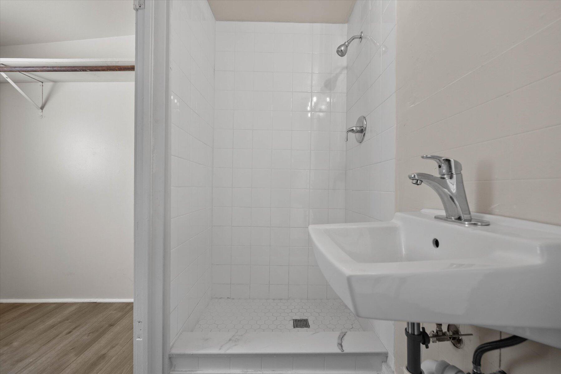 7936 Terrace Road Lantana, FL 33462 - Photo 16 of 25 a bathroom with a sink and shower