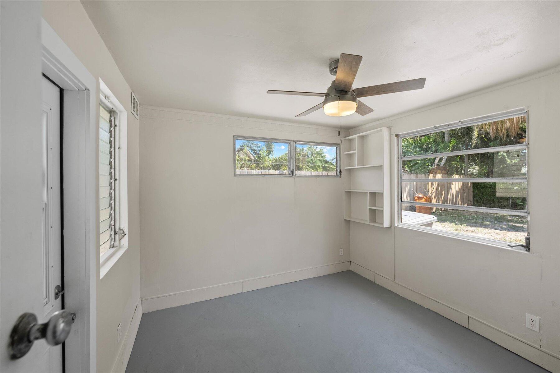 7936 Terrace Road Lantana, FL 33462 - Photo 19 of 25 a view of an empty room with a window