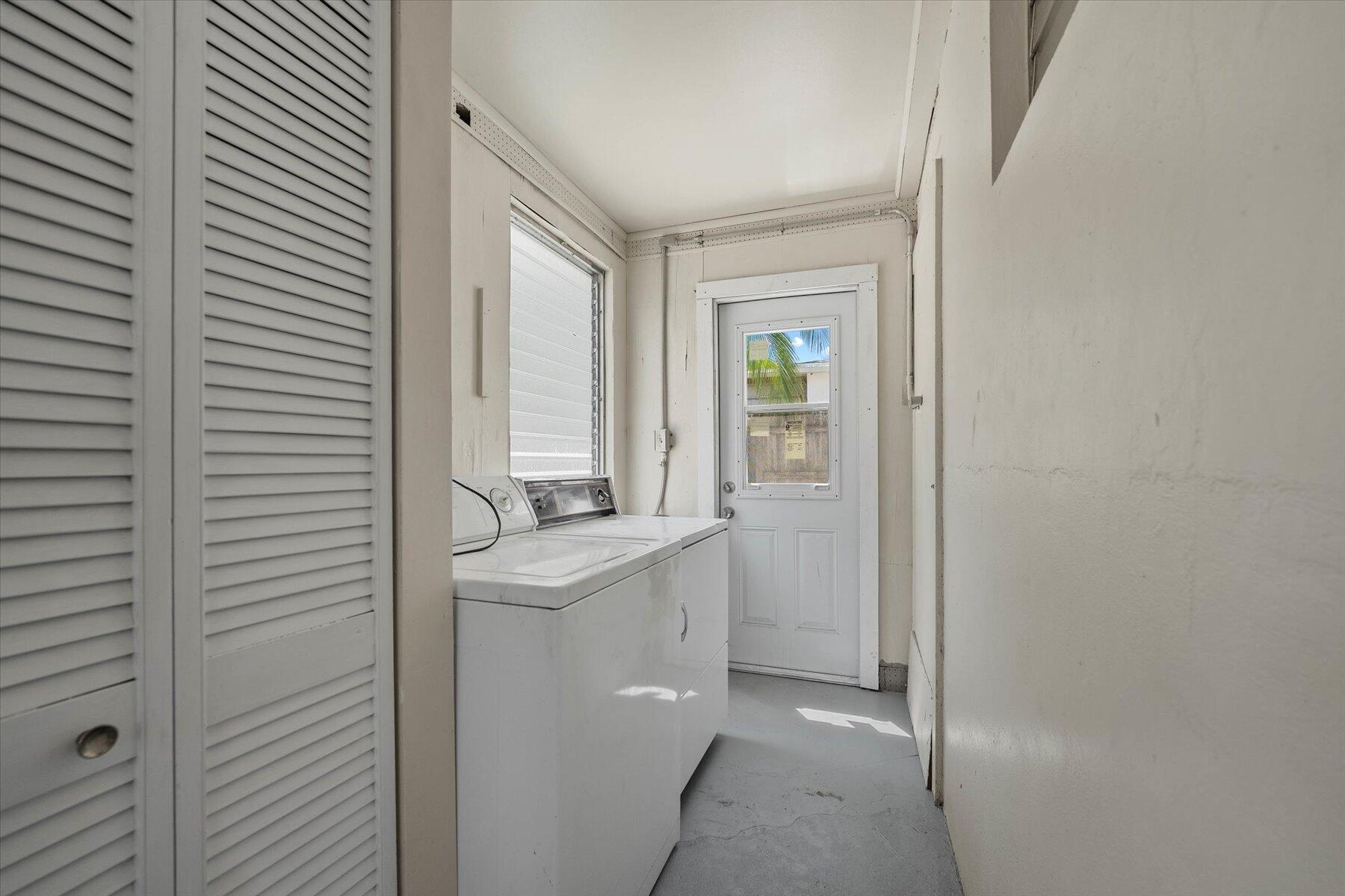 7936 Terrace Road Lantana, FL 33462 - Photo 21 of 25 a bathroom with a granite countertop sink and a mirror