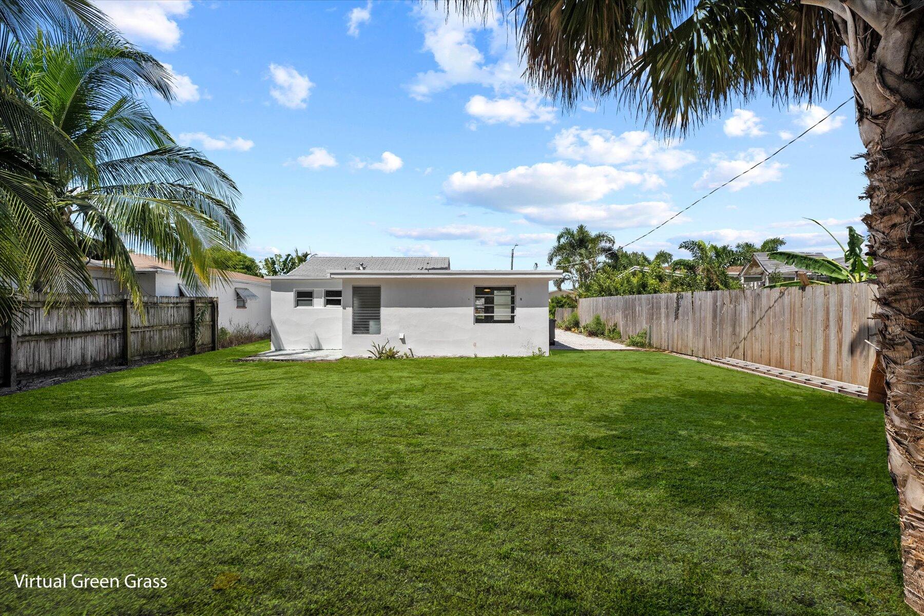 7936 Terrace Road Lantana, FL 33462 - Photo 22 of 25 a view of a house with a yard