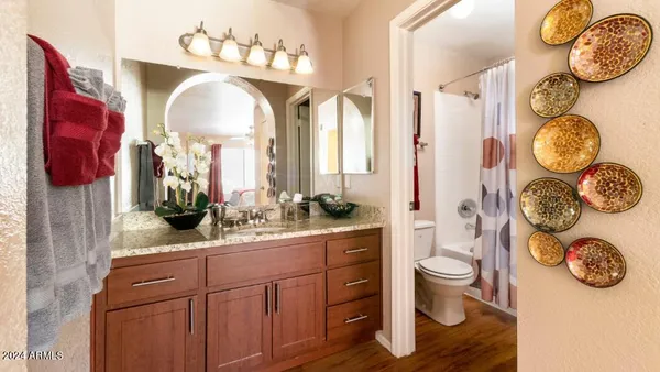 a bathroom with a toilet and a sink