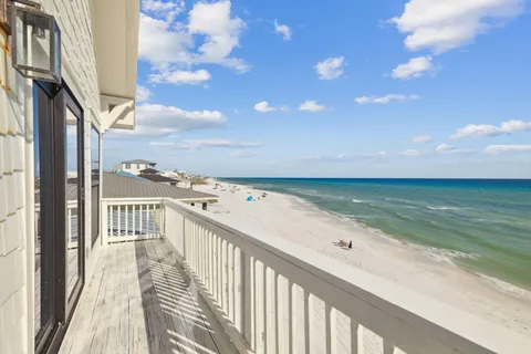 a bedroom with a large bed and a large window