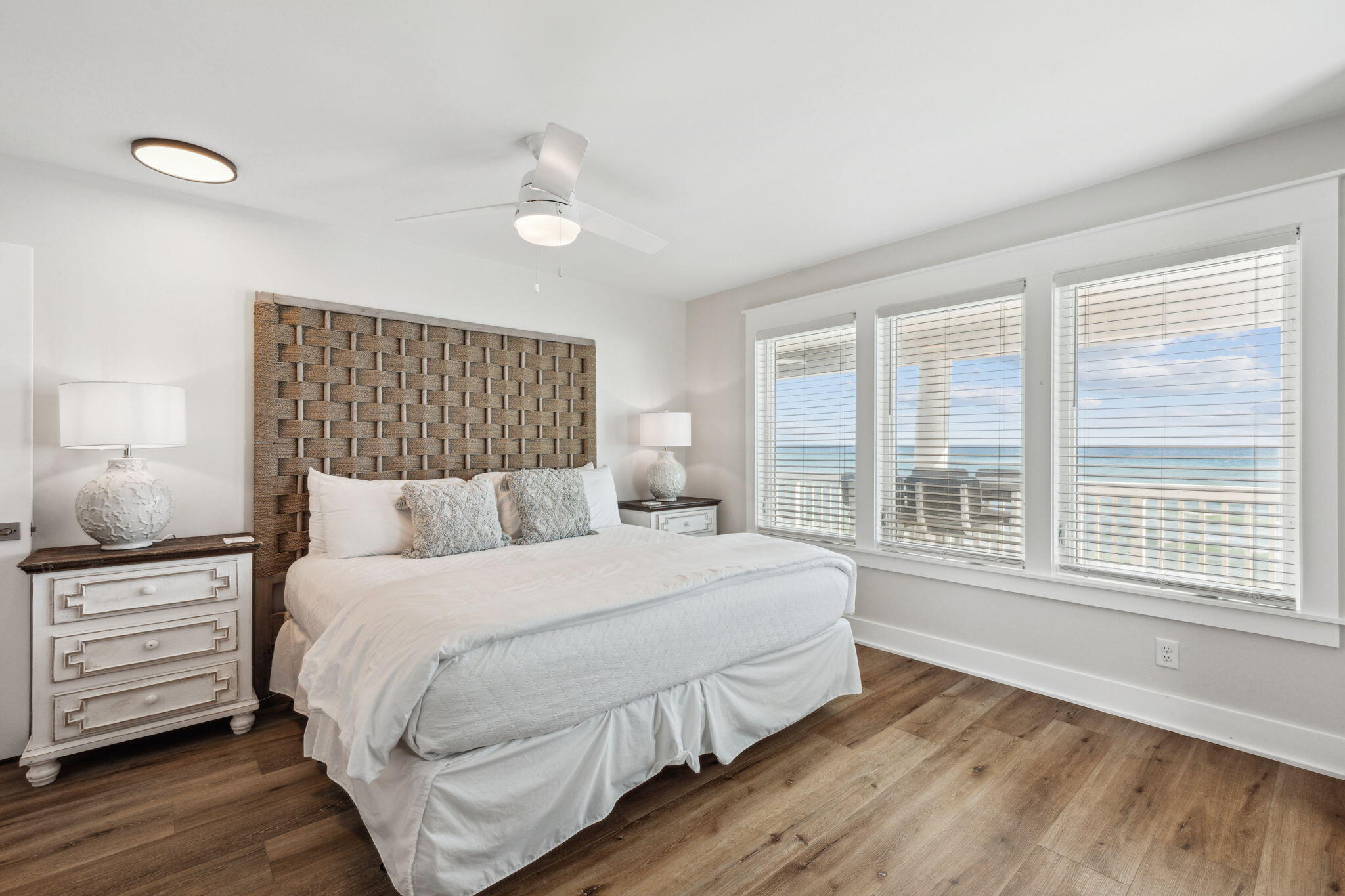 103 Fort Panic Road Santa Rosa Beach, FL 32459 - Photo 16 of 60 a bedroom with a large bed and a large window