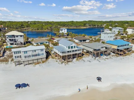 a kitchen with stainless steel appliances granite countertop a white cabinets and a refrigerator