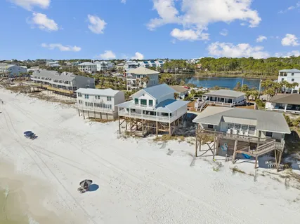 a kitchen with stainless steel appliances kitchen island granite countertop a sink and cabinets