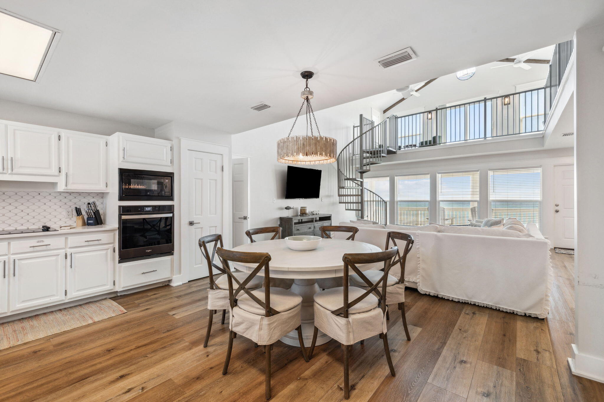 103 Fort Panic Road Santa Rosa Beach, FL 32459 - Photo 42 of 60 a view of a dining room with furniture window and wooden floor