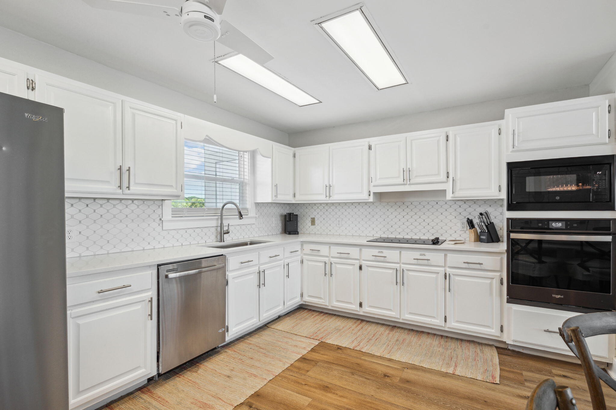 103 Fort Panic Road Santa Rosa Beach, FL 32459 - Photo 45 of 60 a kitchen with cabinets stainless steel appliances and a sink