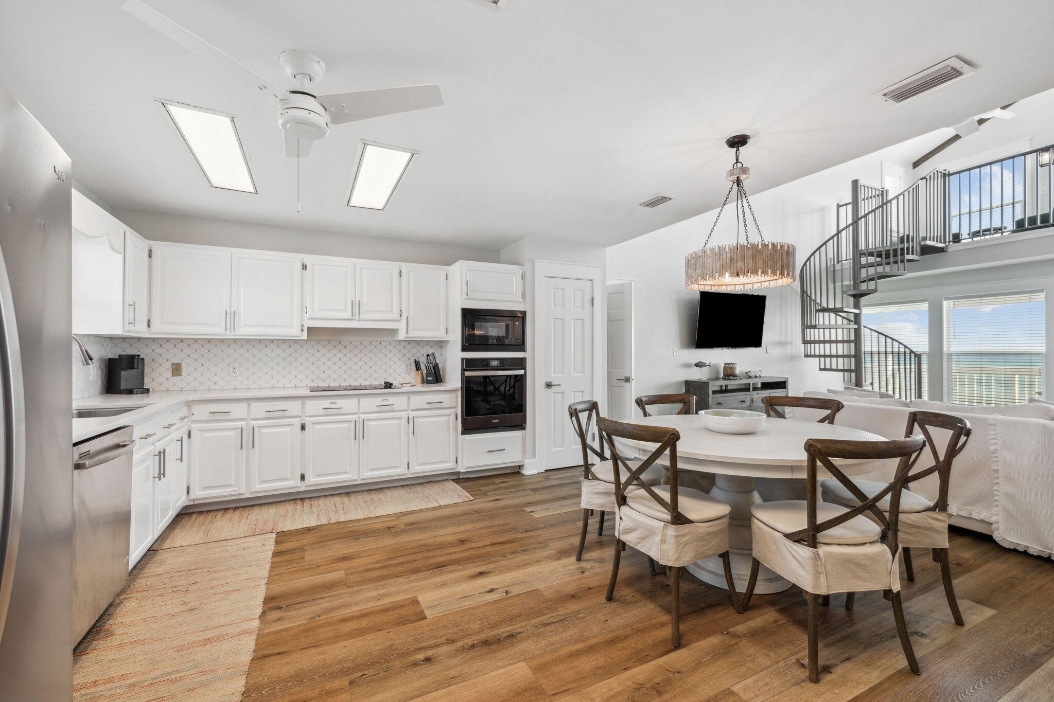 103 Fort Panic Road Santa Rosa Beach, FL 32459 - Photo 46 of 60 a kitchen with stainless steel appliances kitchen island granite countertop a sink and cabinets