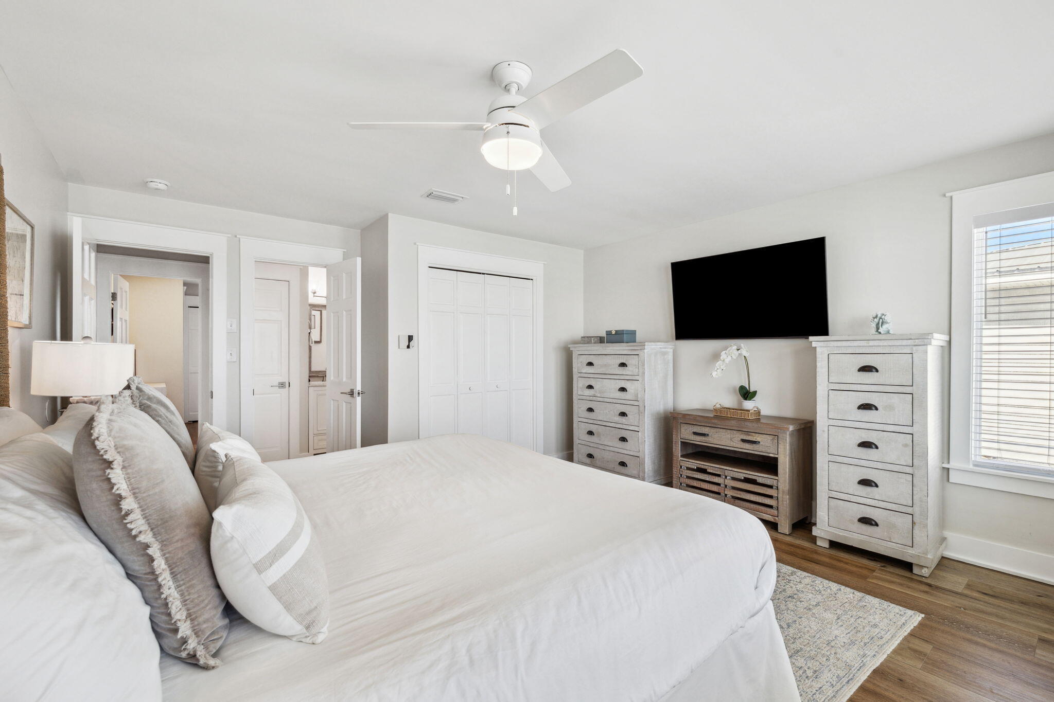 103 Fort Panic Road Santa Rosa Beach, FL 32459 - Photo 48 of 60 a bedroom with a bed and a flat screen tv