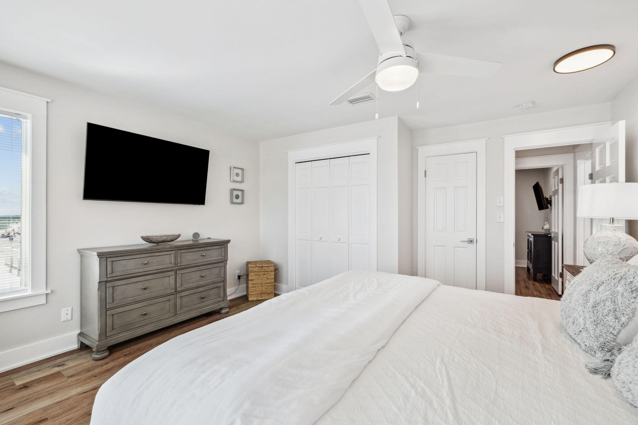 103 Fort Panic Road Santa Rosa Beach, FL 32459 - Photo 53 of 60 a bedroom with a bed and a flat screen tv in it