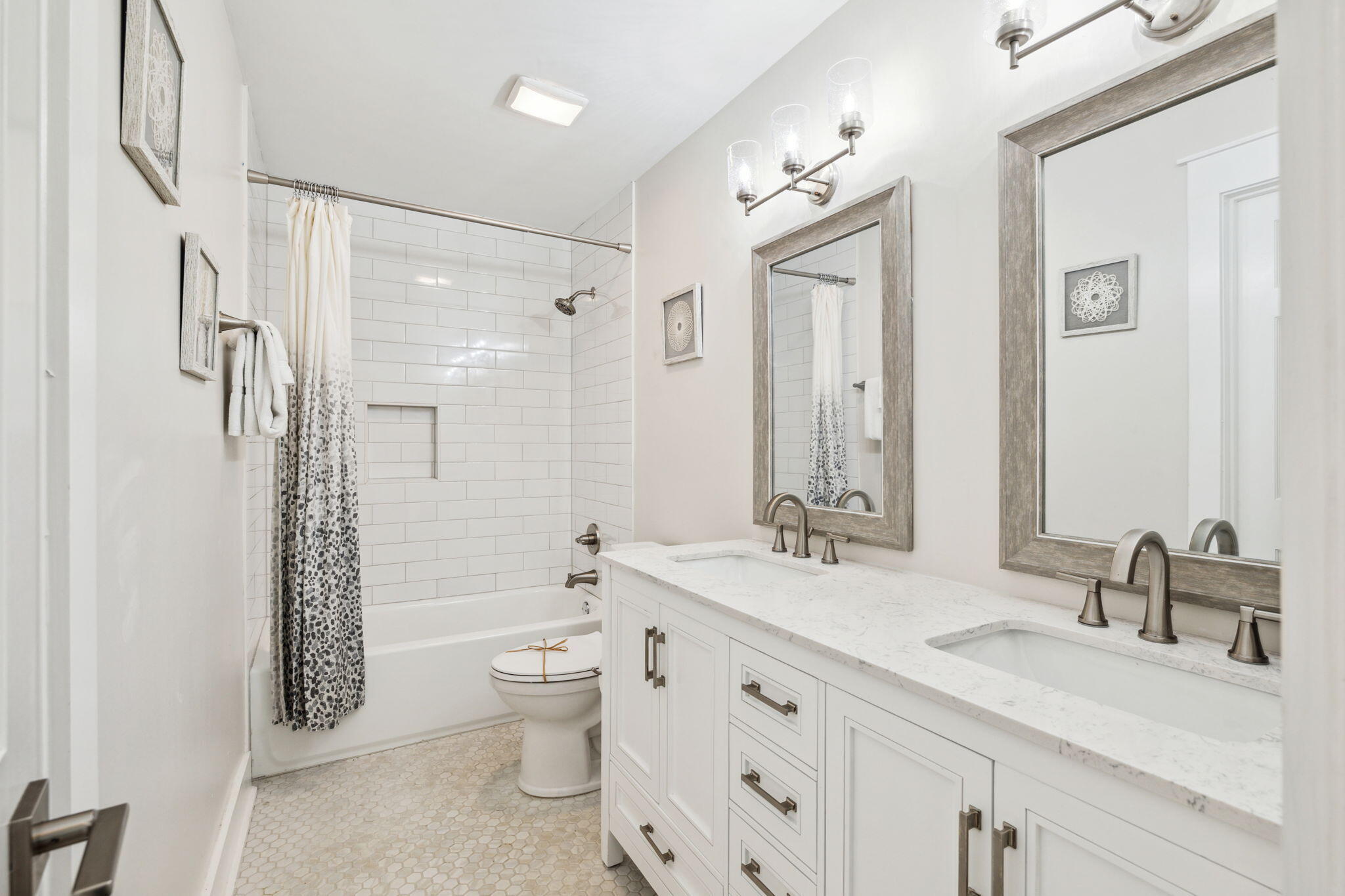 103 Fort Panic Road Santa Rosa Beach, FL 32459 - Photo 54 of 60 a bathroom with a double vanity sink toilet mirror and shower