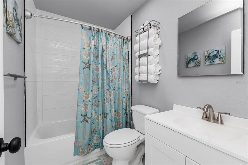 4319 Eaglet Road Punta Gorda, FL 33980 - Photo 11 of 22 a white toilet sitting next to a bathroom sink