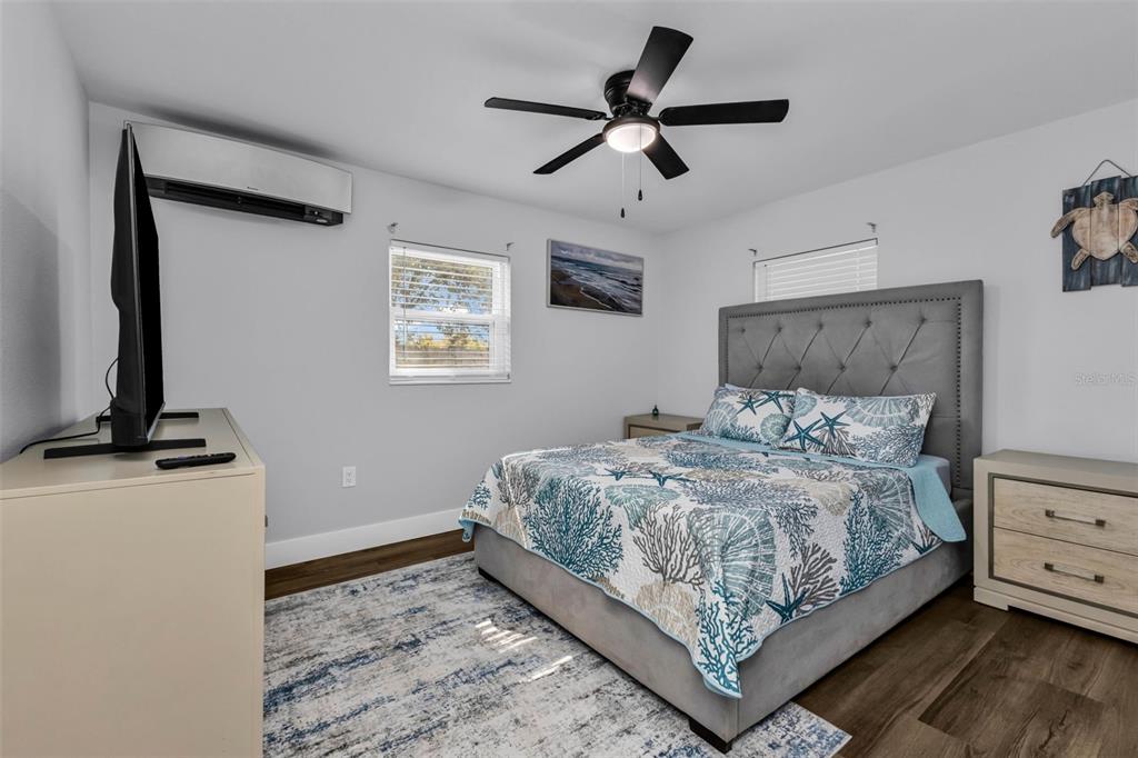 4319 Eaglet Road Punta Gorda, FL 33980 - Photo 12 of 22 a bedroom with a bed and a flat screen tv