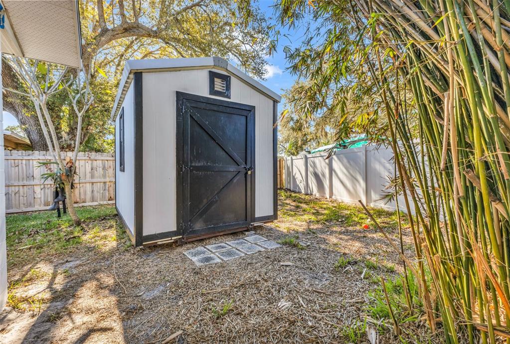 4319 Eaglet Road Punta Gorda, FL 33980 - Photo 20 of 22 a view of backyard and tree