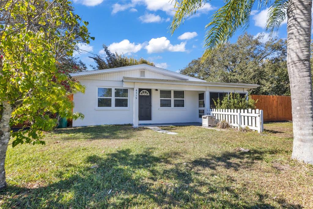 4319 Eaglet Road Punta Gorda, FL 33980 - Photo 2 of 22 a backyard of a house with large trees and barbeque oven
