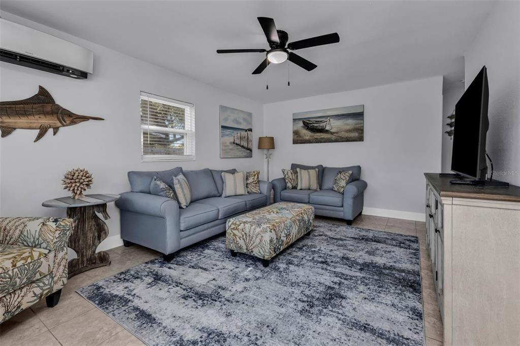 4319 Eaglet Road Punta Gorda, FL 33980 - Photo 3 of 22 a living room with furniture and a flat screen tv
