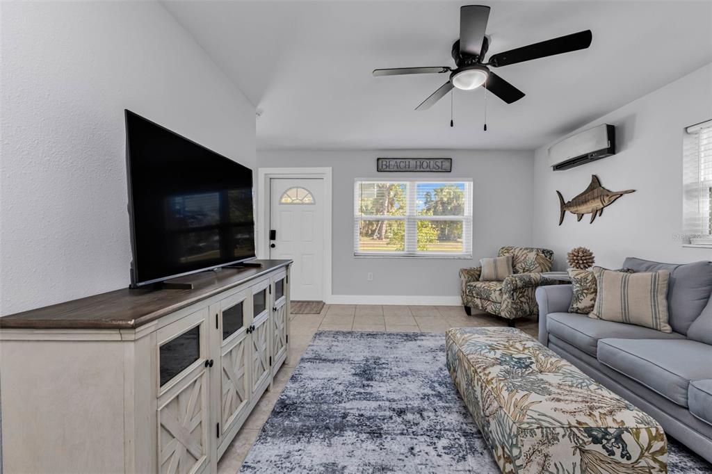 4319 Eaglet Road Punta Gorda, FL 33980 - Photo 5 of 22 a living room with furniture and a flat screen tv