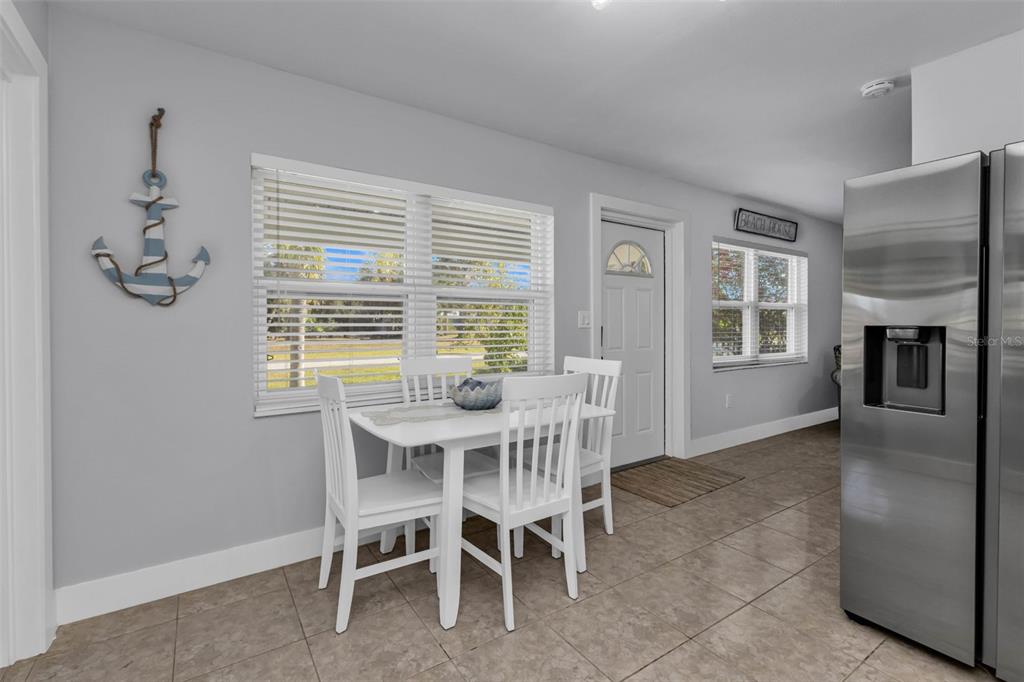 4319 Eaglet Road Punta Gorda, FL 33980 - Photo 6 of 22 a view of a dining room with furniture window and wooden floor