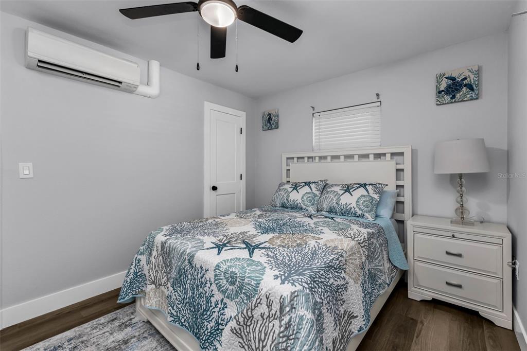 4319 Eaglet Road Punta Gorda, FL 33980 - Photo 10 of 22 a bedroom with a bed and a lamp on the dresser