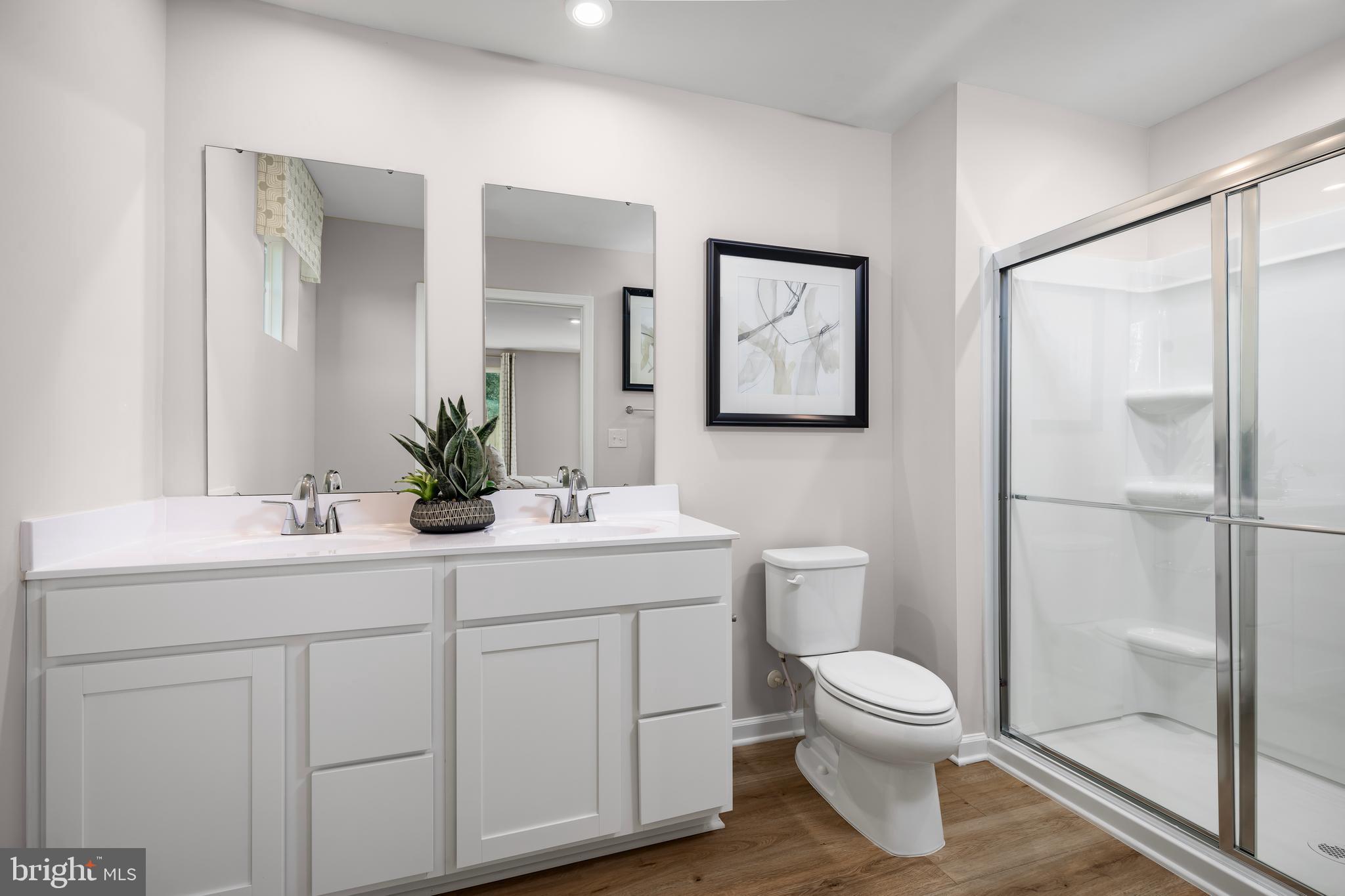 4408 Mutual Drive Inwood, WV 25428 - Photo 11 of 15 a bathroom with a toilet sink and mirror