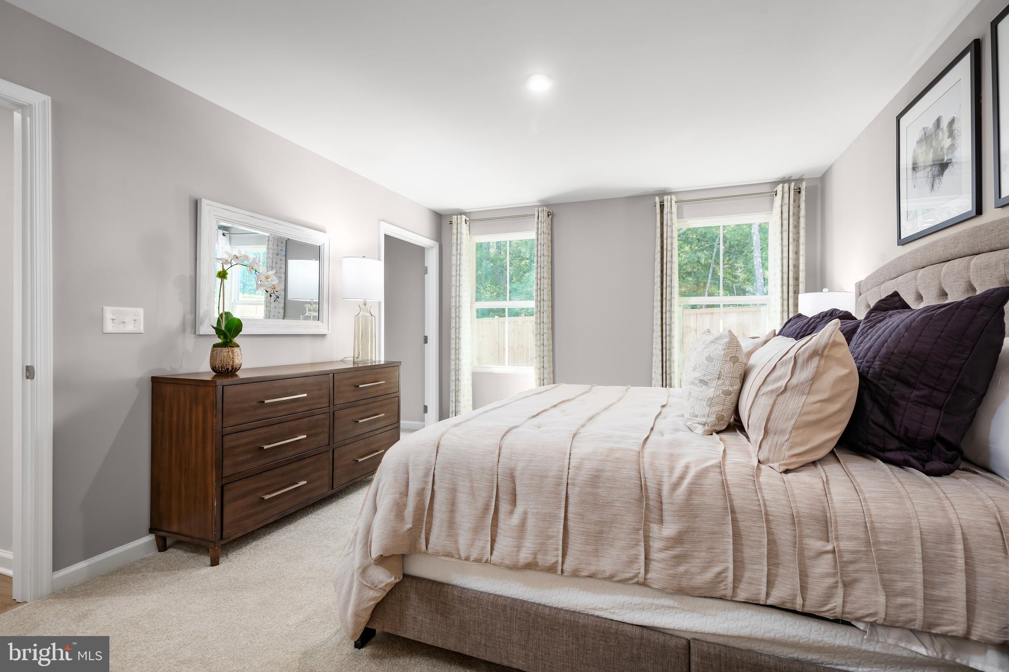 4408 Mutual Drive Inwood, WV 25428 - Photo 9 of 15 a bedroom with a bed and window with chair