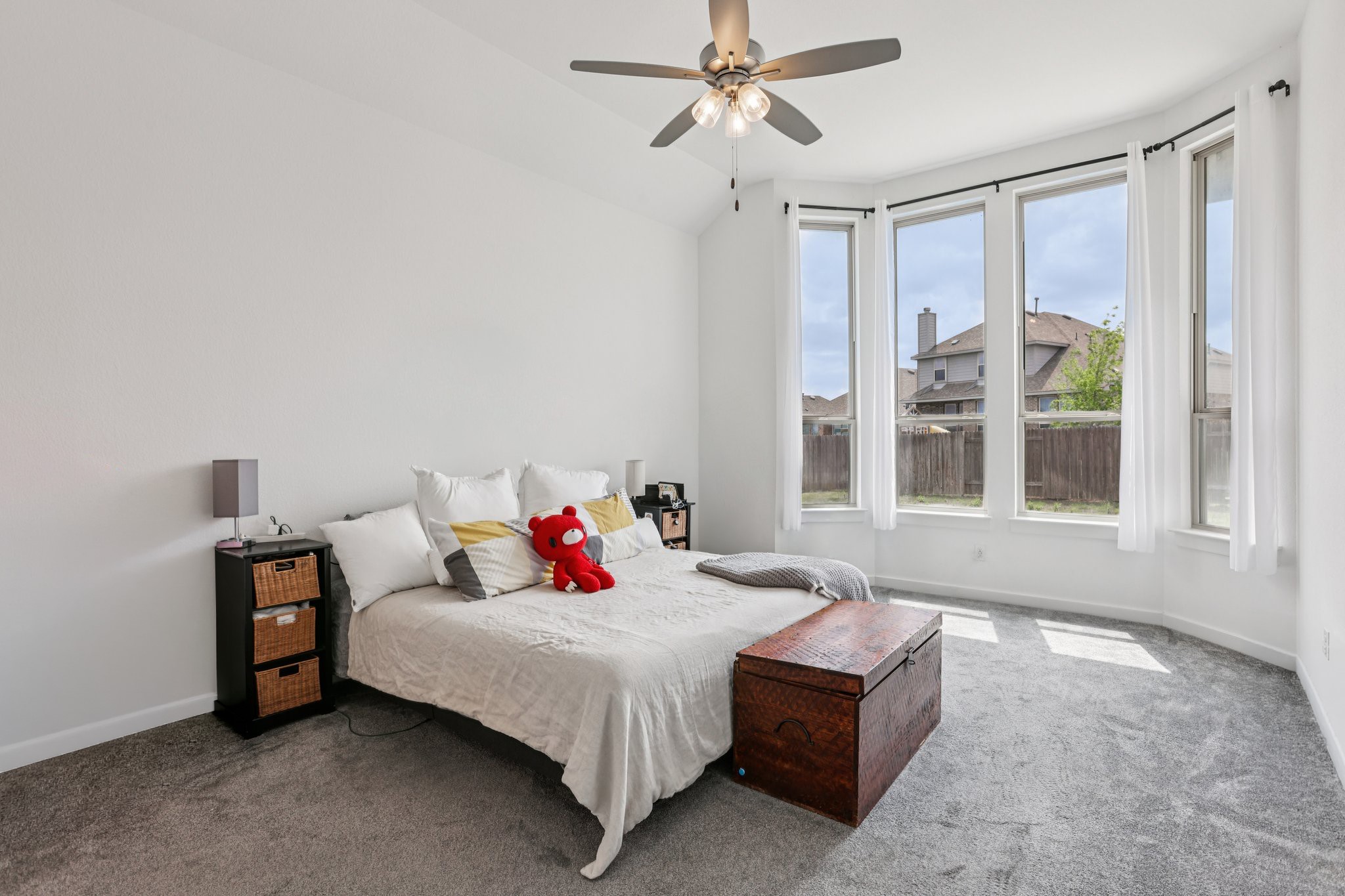 930 Nautical Loop Kyle, TX 78640 - Photo 10 of 25 Large primary bedroom (that's a king size bed) with high ceilings, lovely bay windows