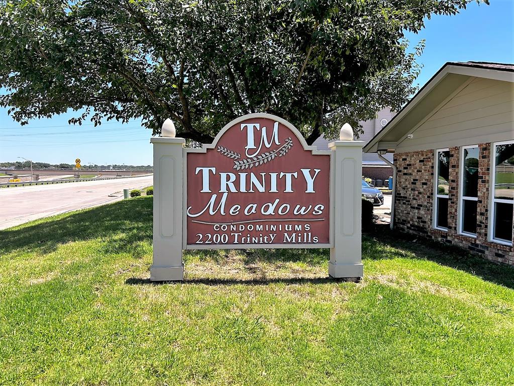 2200 East Trinity Mills Road, Unit 301 Carrollton, TX 75006 - Photo 1 of 16 a view of outdoor space with sign board