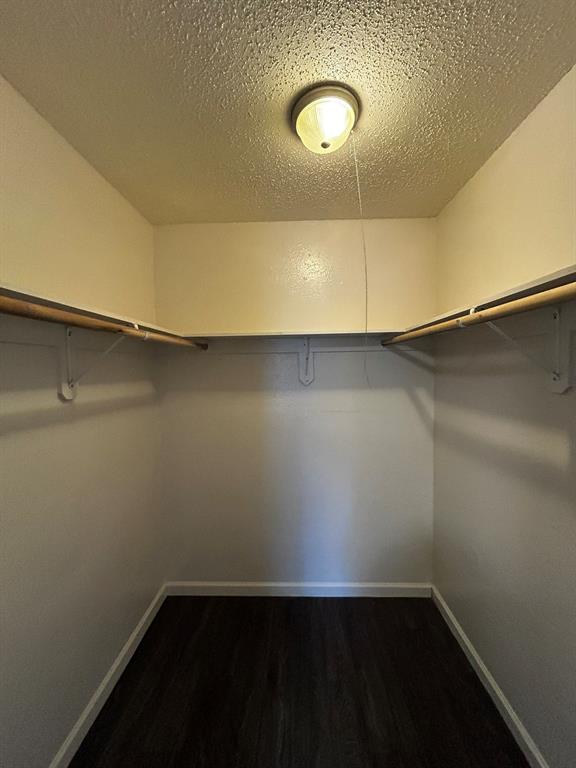 2200 East Trinity Mills Road, Unit 301 Carrollton, TX 75006 - Photo 15 of 16 a view of a room with wooden floor