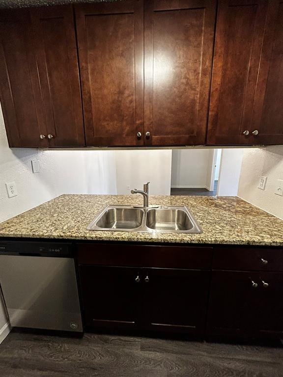 2200 East Trinity Mills Road, Unit 301 Carrollton, TX 75006 - Photo 9 of 16 a view of kitchen island wooden cabinets